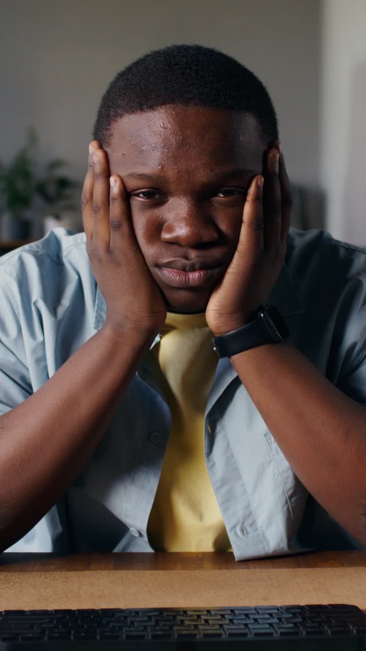 Unhappy young man at computer