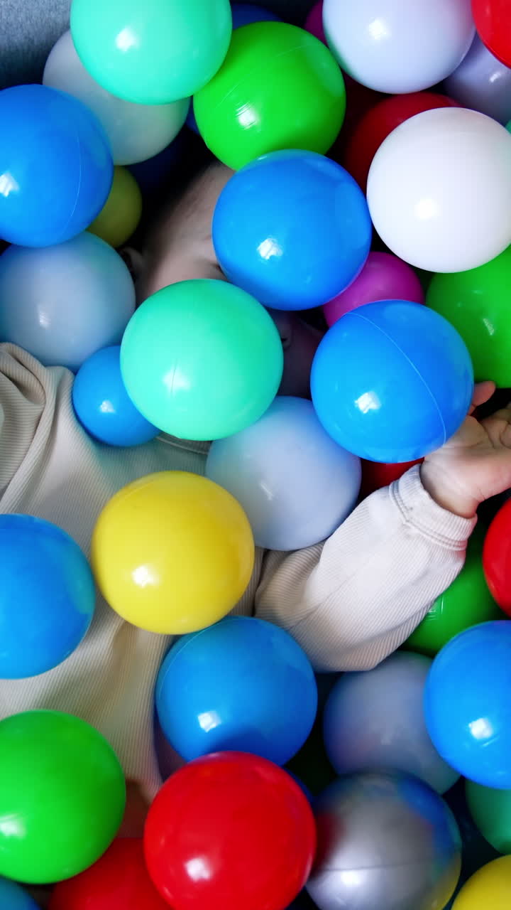 Baby in a Colorful Ball Pit