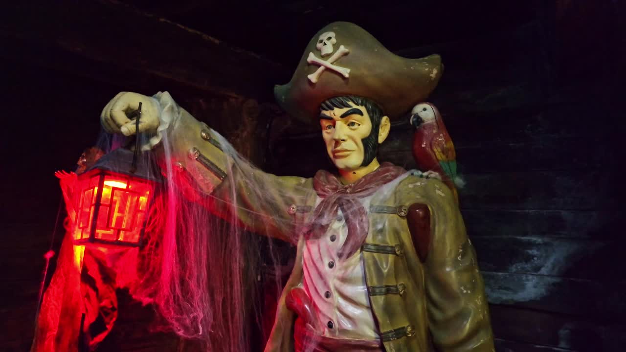 Exhibited pirate statue at a museum with lantern in his hand, Saint-Malo, France.