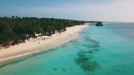 amazing aerial flight fly backwards over crystal clear turquoise water drone shot