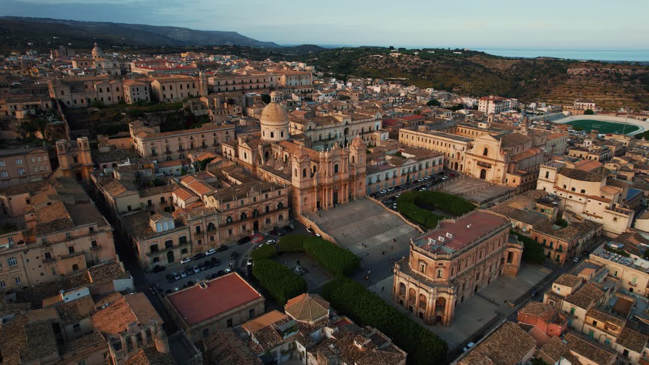 Noto San Nicolò Cathedral and Piazza Municipio with soft shadows and warm color. Evening drone shot