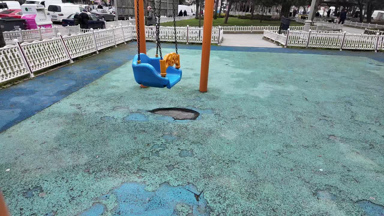 Damaged Playground Swing Set