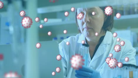 células de covid-19 contra una mujer científica que trabaja en un laboratorio