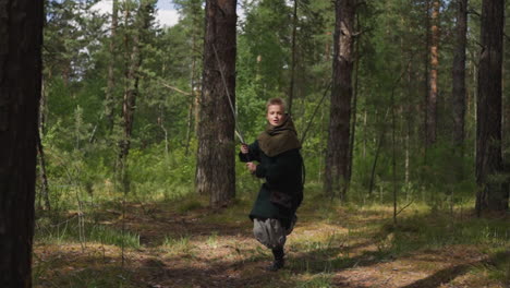 little warrior boy runs with sword to attack