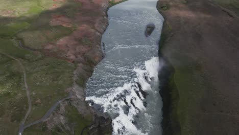 high above gullfoss waterfall on cloudy day in iceland, golden circle