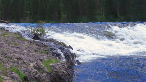 flowing river and falls in the montana wilderness - static nature shot