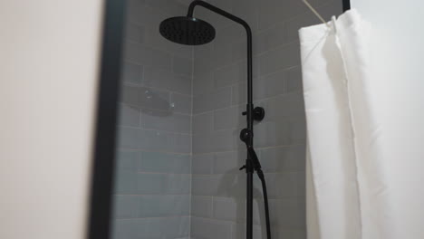 grey shower unit in hotel bathroom. interior of modern room and place for hygiene procedures. decorative elements in premise of rented glamping apartment