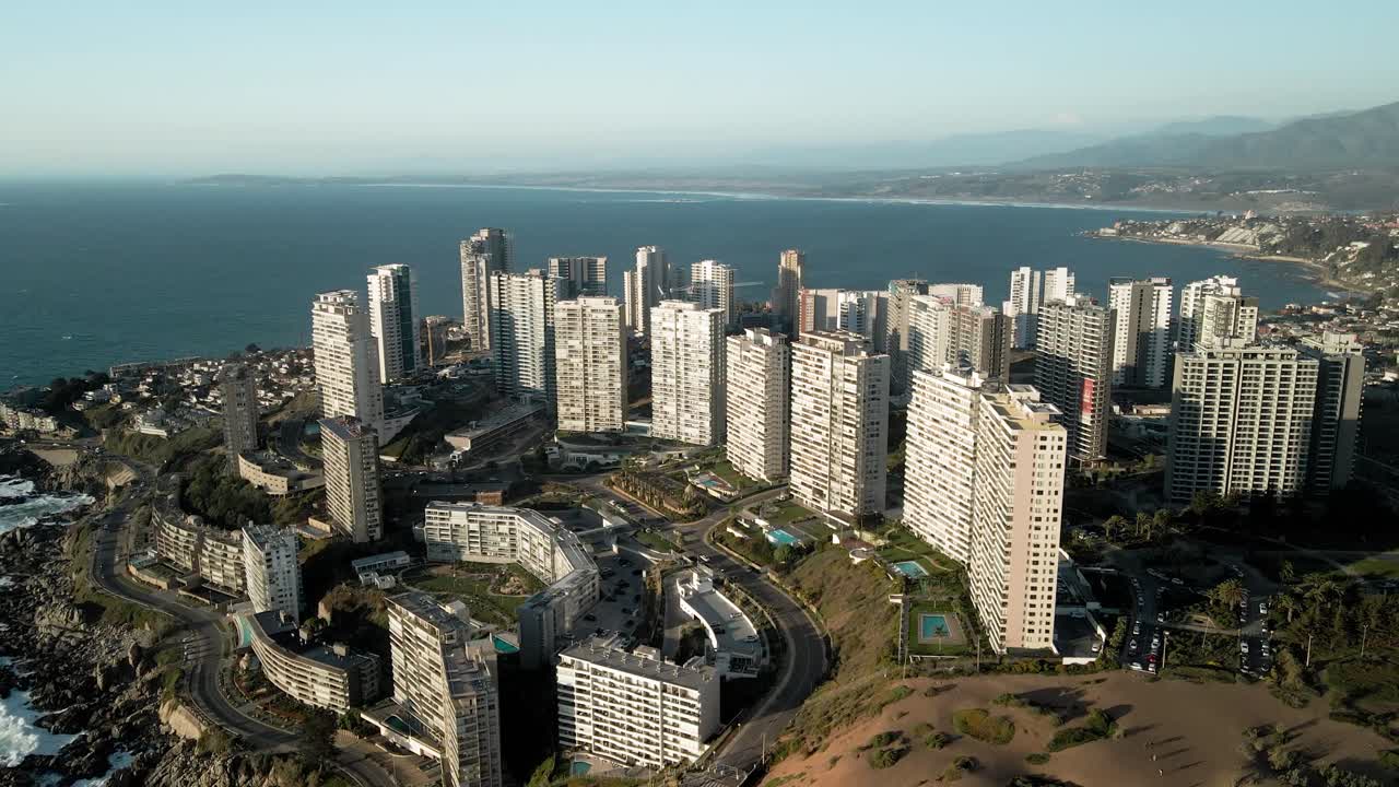 Aerial View of Coastal City with High-Rise Buildings