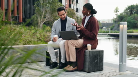 two business people have a casual meeting by a waterfront in a modern city