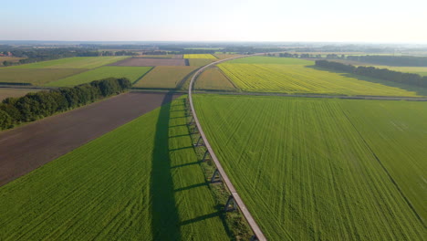 Panorama-Of-Magnetic-Transrapid-Test-Track-With-Green-Fields-And-Clear-Sky-In-Lathen,-Germany---aerial-drone-shot