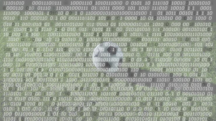 Binary code intensifying while soccer player approaching ball and kicking for sports analytics