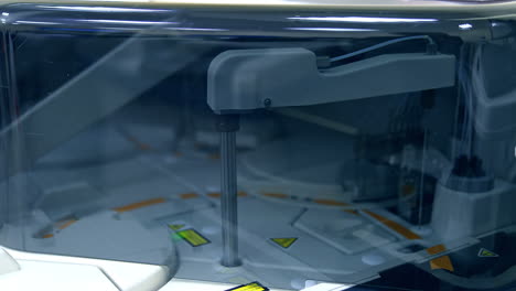 moving details inside the technological machine. advanced equipment in modern laboratory for medical tests. close up.