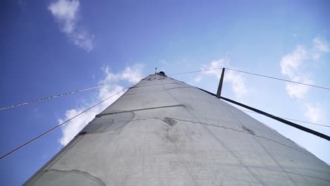 the upwards shot of sail in a yacht from the deck