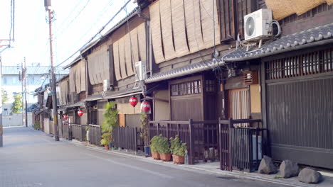 Traditional-Japanese-lanterns-hanging-outside-of-restaurants-during-the-day-in-Kyoto,-Japan-soft-lighting