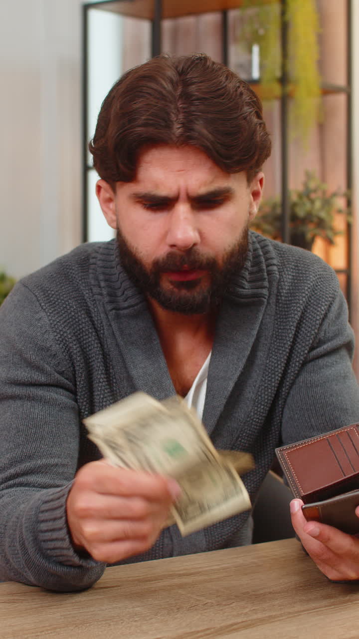 Indian man opens wallet finds small dollar cash unhappy budget worry debt low income poverty sad low