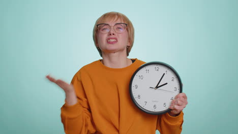 Woman-in-glasses-with-anxiety-checking-time-on-clock,-running-late-to-work,-being-in-delay,-deadline