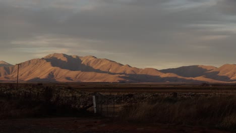 Sunset-in-New-Zealand-with-red-sky-and-beautiful-foreground