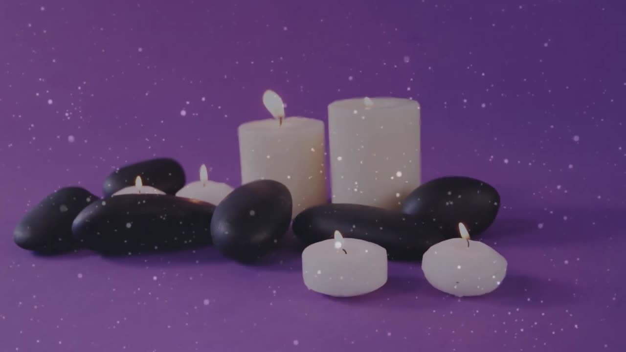 animación de puntos de luz sobre velas y piedras