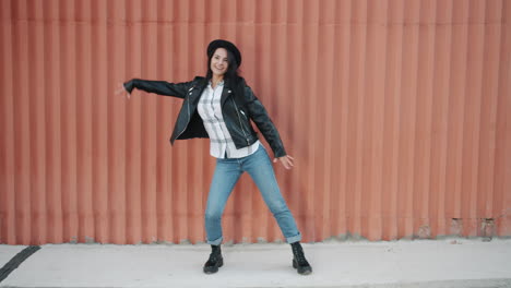 stylish woman dancing outdoors