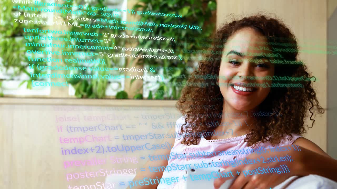 Woman tapping phone on sofa, causing code overlay while exploring tech content and smiling