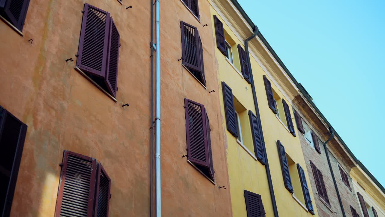 Colorful European Building Facade with Shutters