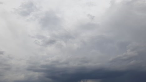 Mid-afternoon-thunderstorm-rain-clouds-forming-and-blending-across-the-african-horizon-time-lapse,-noise-free-4k-footage