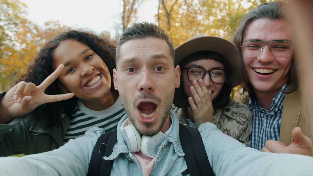 Happy Friends Taking a Selfie in Autumn Park
