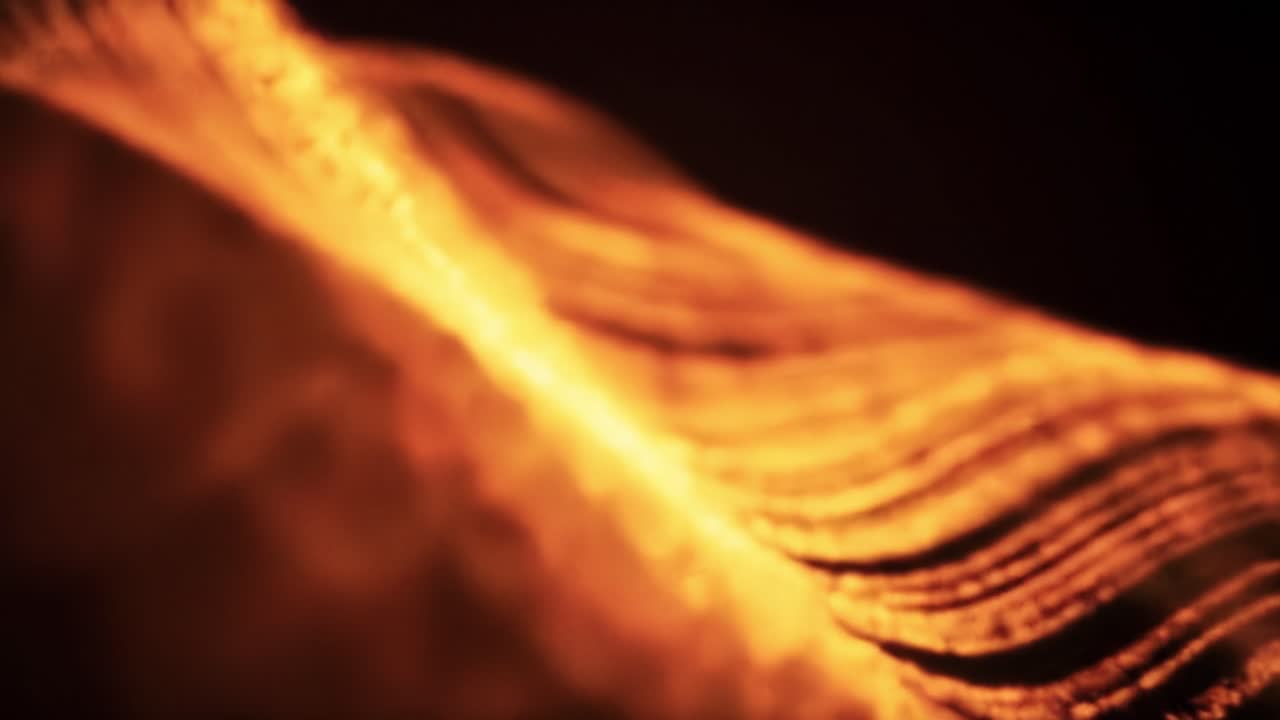 This captivating display features flowing patterns in vibrant orange hues, showcasing a dynamic interplay of light and movement.