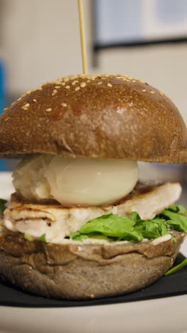 final result of the preparation of a gourmet burger with grilled swordfish