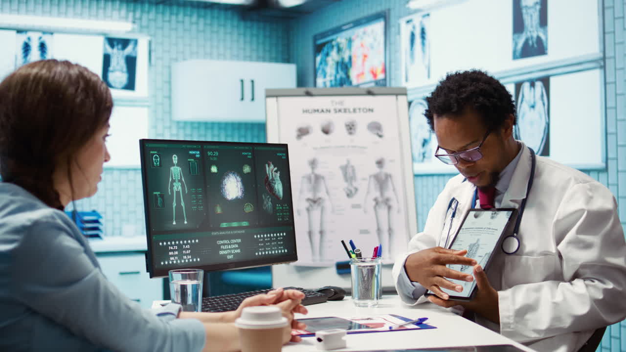 African american specialist showing the human skeleton to explain diagnosis