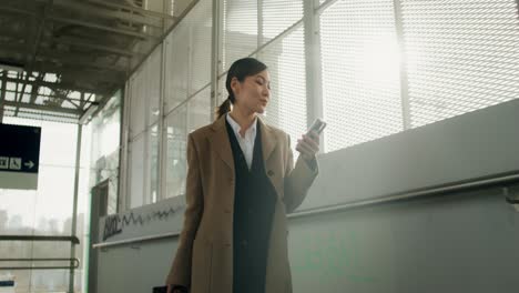 businesswoman walking in train station