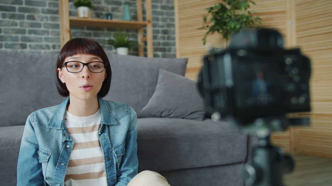 Woman vlogging at home