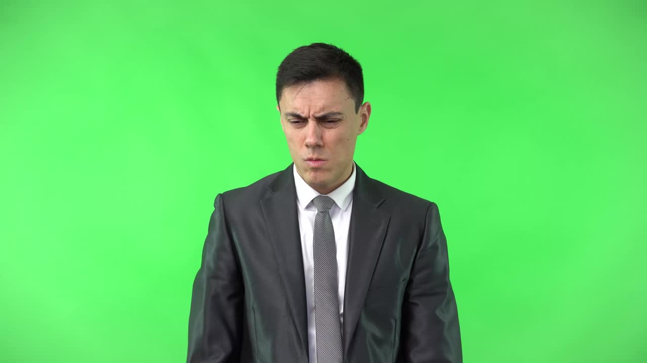 Businessman in Suit Thinking and Counting on Green Screen