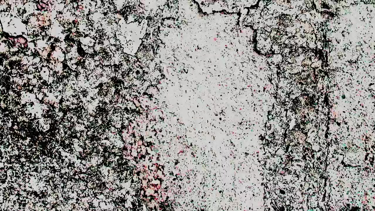 Abstraktní mihotavá textura opotřebovaného povrchu zdi