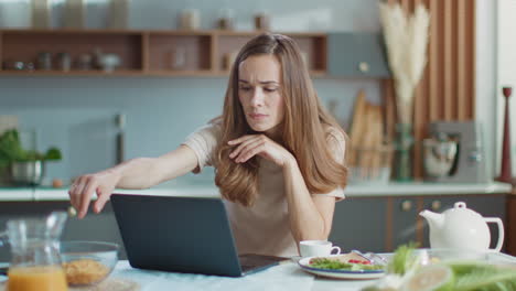 businesswoman using laptop at home office. woman working on laptop at workplace