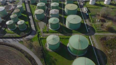 Aerial-view-of-steel-round-Oil-Storage-Tanks,-storage-and-handling-services-for-petroleum-products