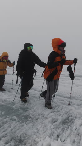 hikers on a glacier