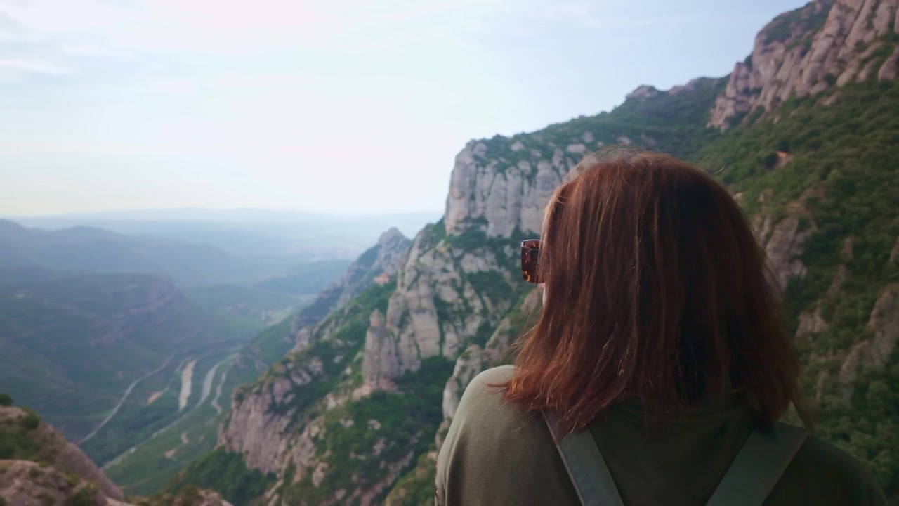 Woman admiring the Montserrat mountain range in Spain