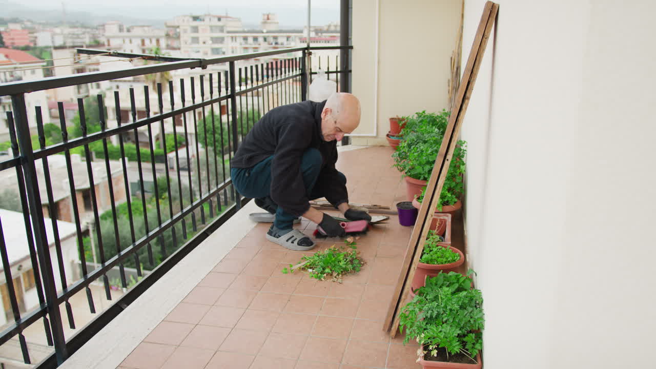 Senior Man Gardening on Balcony