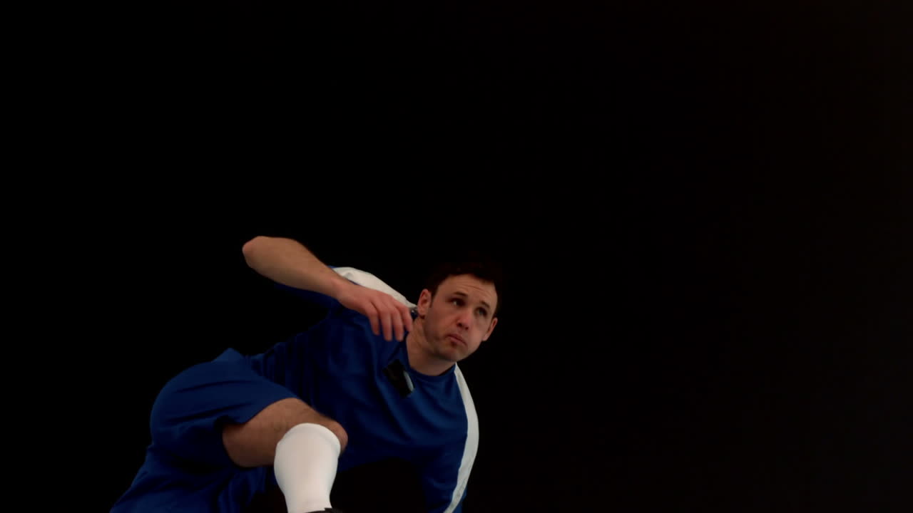 Football player kicking the ball