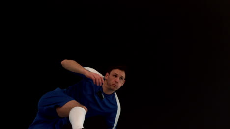 football player kicking the ball