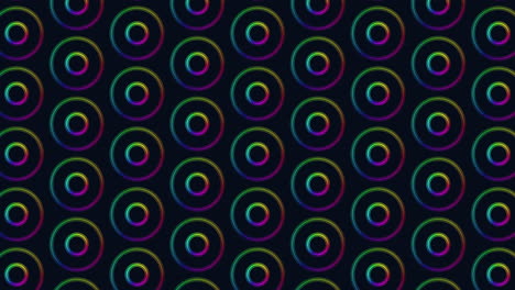 los círculos coloridos crean un patrón circular vibrante sobre un fondo negro