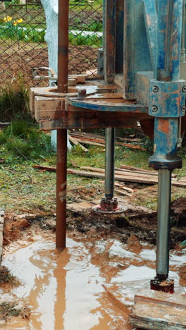 industrial well drilling equipment. pipe machinery drilling. vertical video.