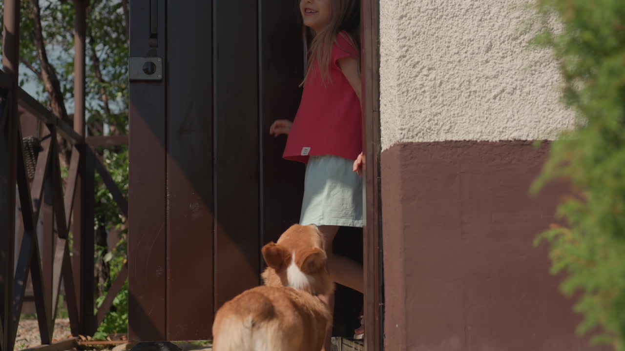 Woman And Kid Stroll Through Garden With Lively Dog, Family Enjoying Cheerful Day In Beautiful Garden Setting With Pet, Warm Family Moment As Mother And Child Exit Garden With Active Dog Nearby