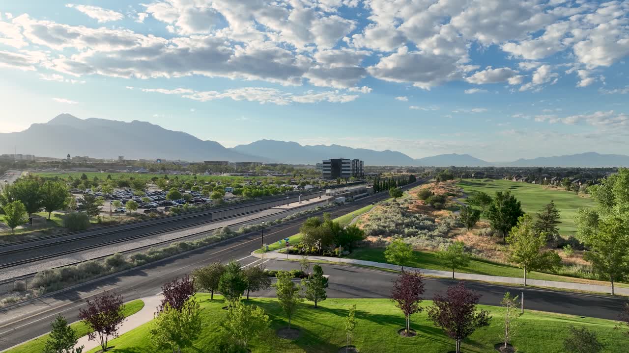 Lehi Frontrunner Station And Thanksgiving Point Golf Course At Morning In Utah. Rising Aerial Shot