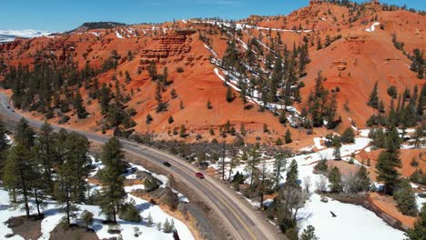 aerial view of traffic on scenic route in landscape of utah usa on sunny winter day