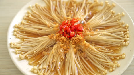 homemade steamed golden needle mushroom or enokitake with soy sauce, chilli and garlic