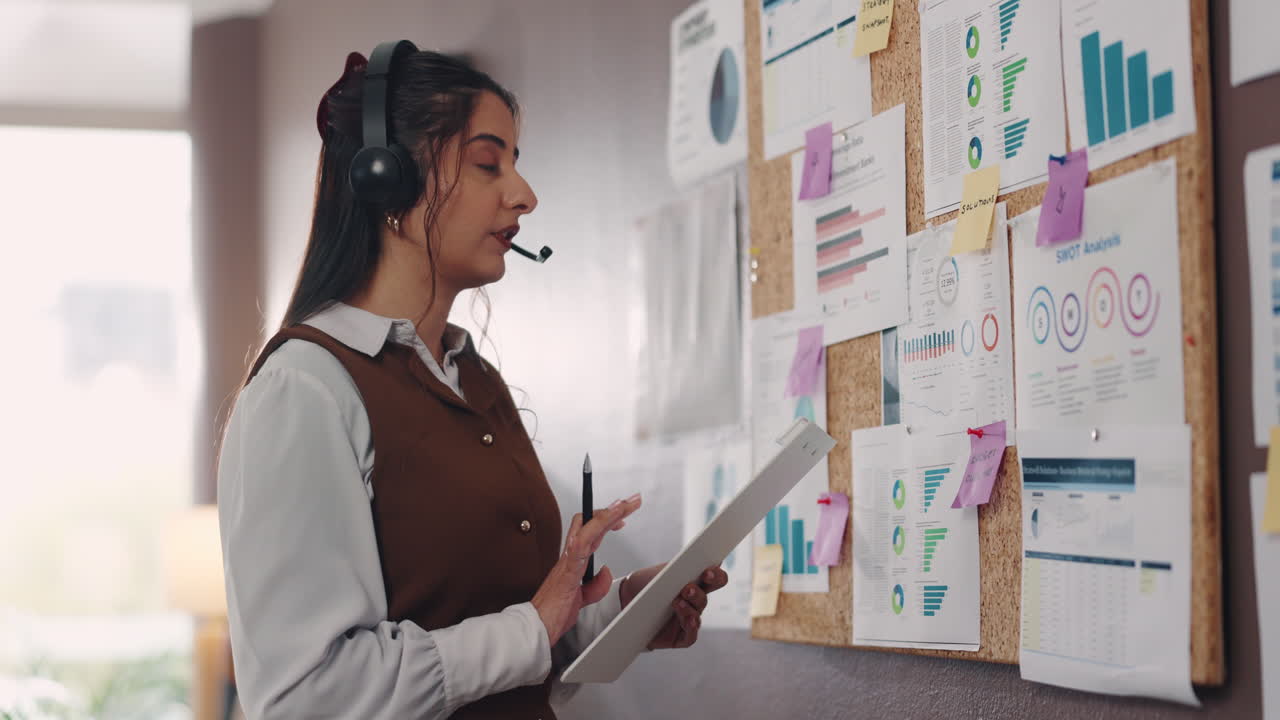 Business woman giving presentation using graphs and analytics