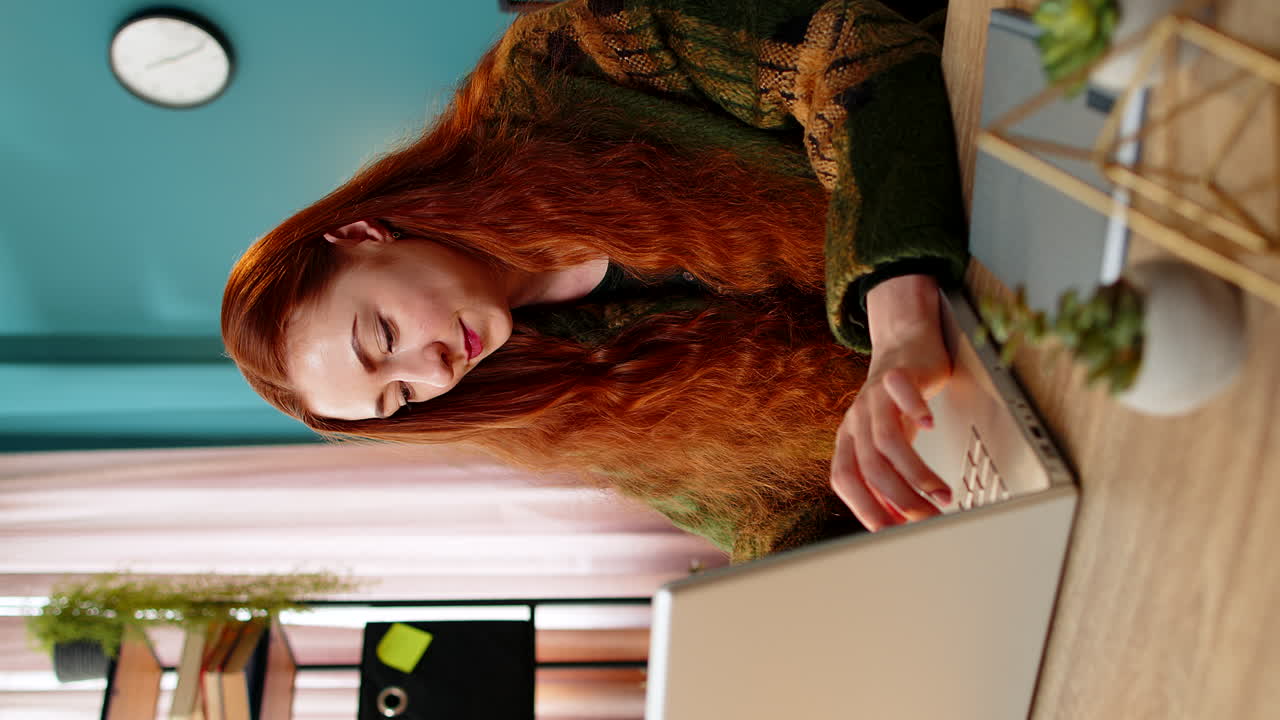 Inspired happy woman make eureka gesture raises finger came up with creative plan working on laptop