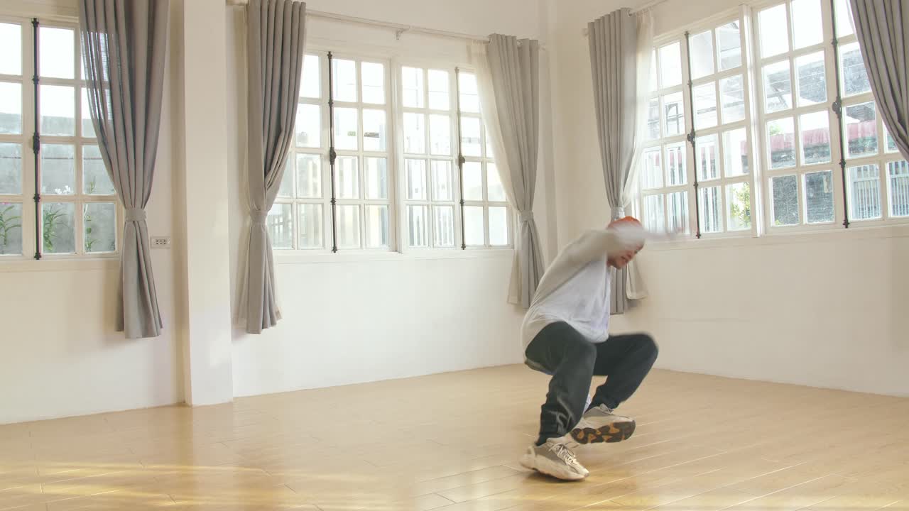 Young Man Hipster Is Performing Breakdance Show In Studio, Video In 4K 50Fps